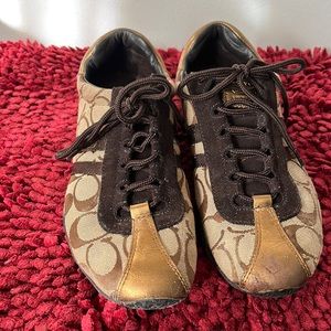 Brown and gold coach sneakers